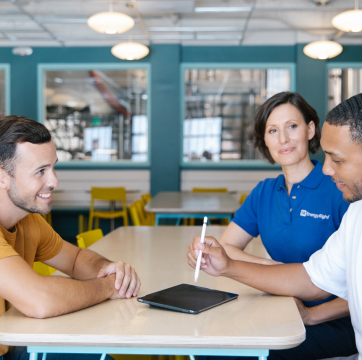 TVA employees speaking with client