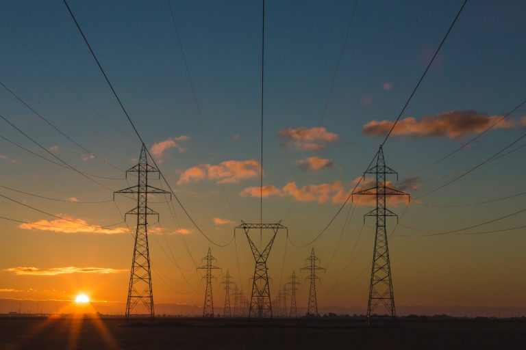 Outdoor power lines with a sunset in the background