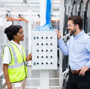 Employees reviewing a panel