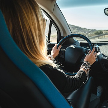 Woman driving EV