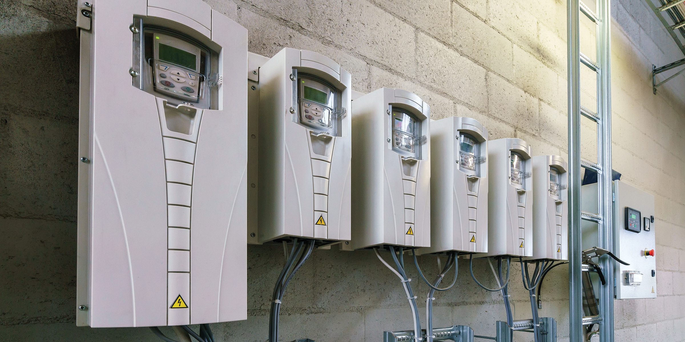 row of variable speed drives in a commercial or an industrial setting