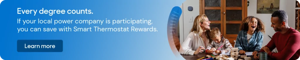 Image of a happy family, playing games. When you click on the image, it will take you to a page to learn more about the Smart Thermostat Rewards program.