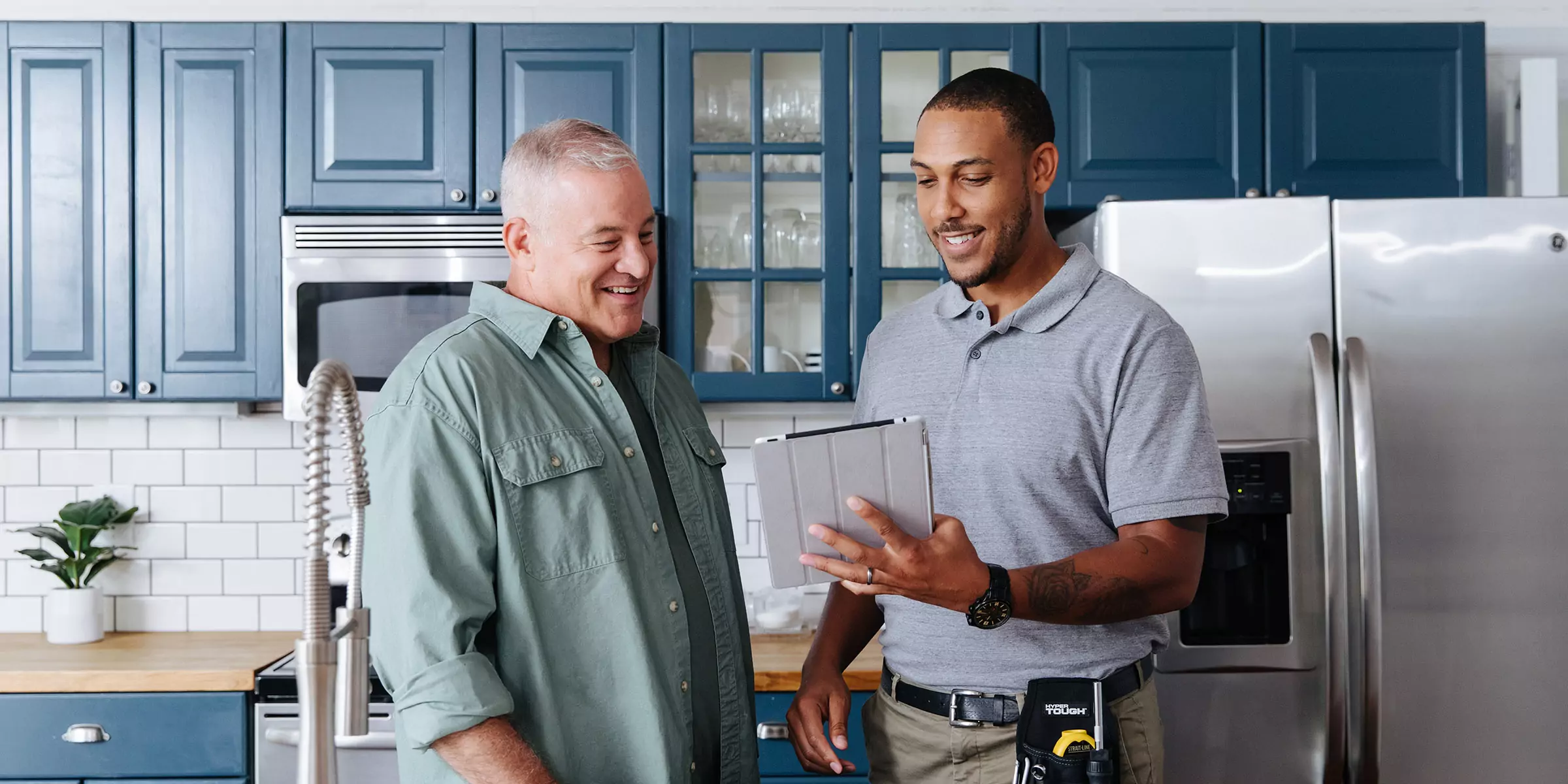 homeowner and TVA EnergyRight Home Energy Expert talking in a kitchen.