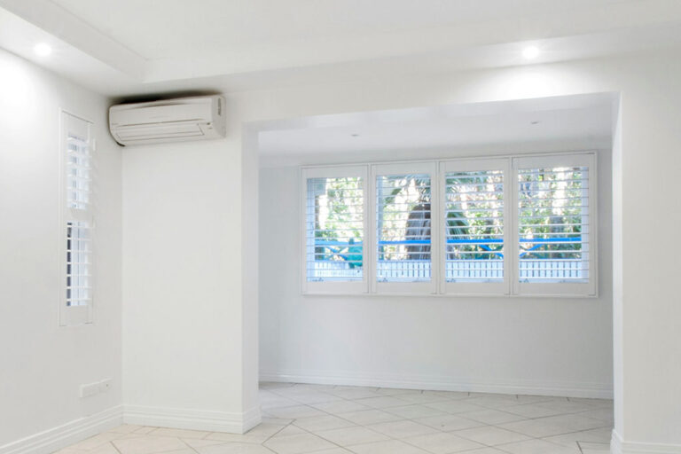 mini split head unit in a white room.