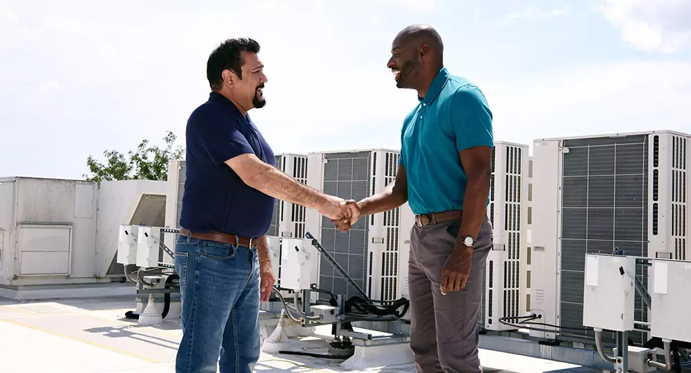 Business owner shaking hands with a TVA EnergyRight Energy Expert