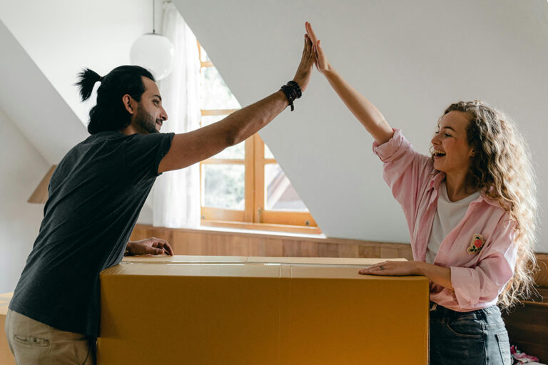 Couple high-fiving