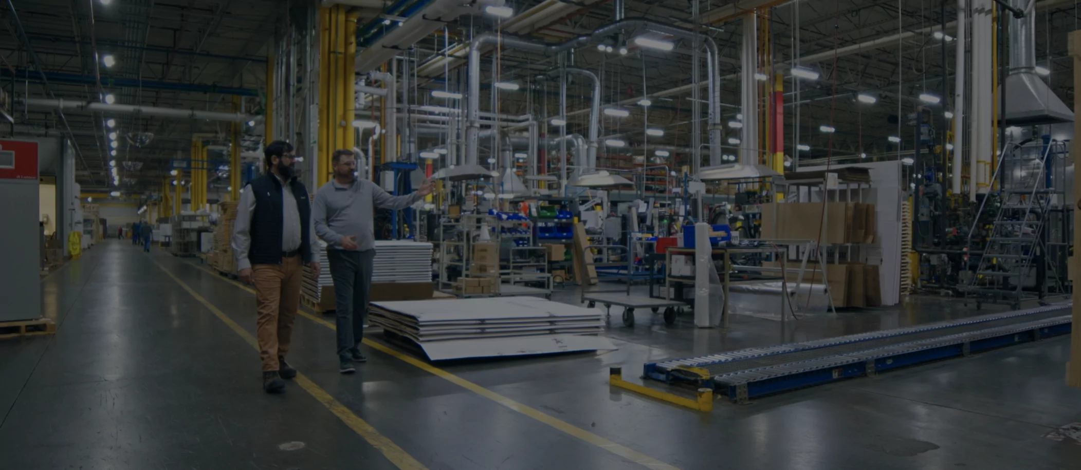 Energy advisor talking to plant operations manager