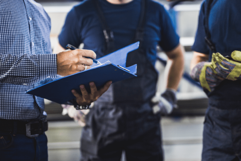 Workers gathered in a semi-circle.