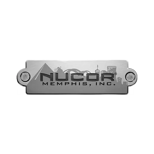 NUCOR MEMPHIS, INC. corporate logo, featuring the name on a metallic plate with a city skyline.