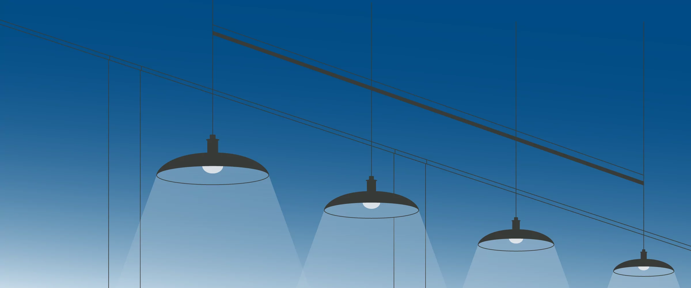 Industrial LED pendant lights illuminate a blue space, highlighting energy-efficient lighting solutions for homes and businesses.
