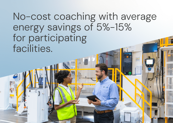 Two TVA Energy Experts consult in a modern industrial facility, illustrating EnergyRight's no-cost coaching for energy savings.