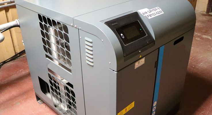 Energy-efficient industrial air dryer with a digital control panel, illustrating commercial equipment optimized by EnergyRight.