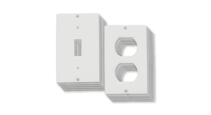Stacks of white wall plates for toggle light switches and duplex electrical outlets.