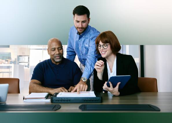 Two TVA Energy Experts consult with a client on energy-saving strategies, reviewing plans and digital tools.