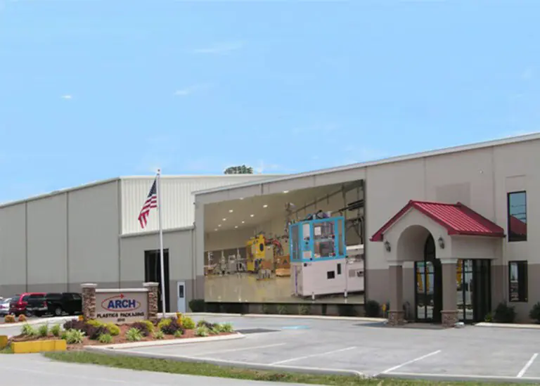 ARCH Plastics Packaging facility with industrial machinery projected on its facade, symbolizing TVA EnergyRight's industrial business solutions.