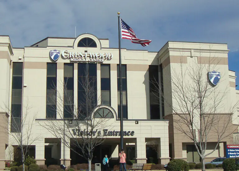 Crestwood Medical Center, a commercial facility with an American flag, represents a candidate for EnergyRight energy solutions.